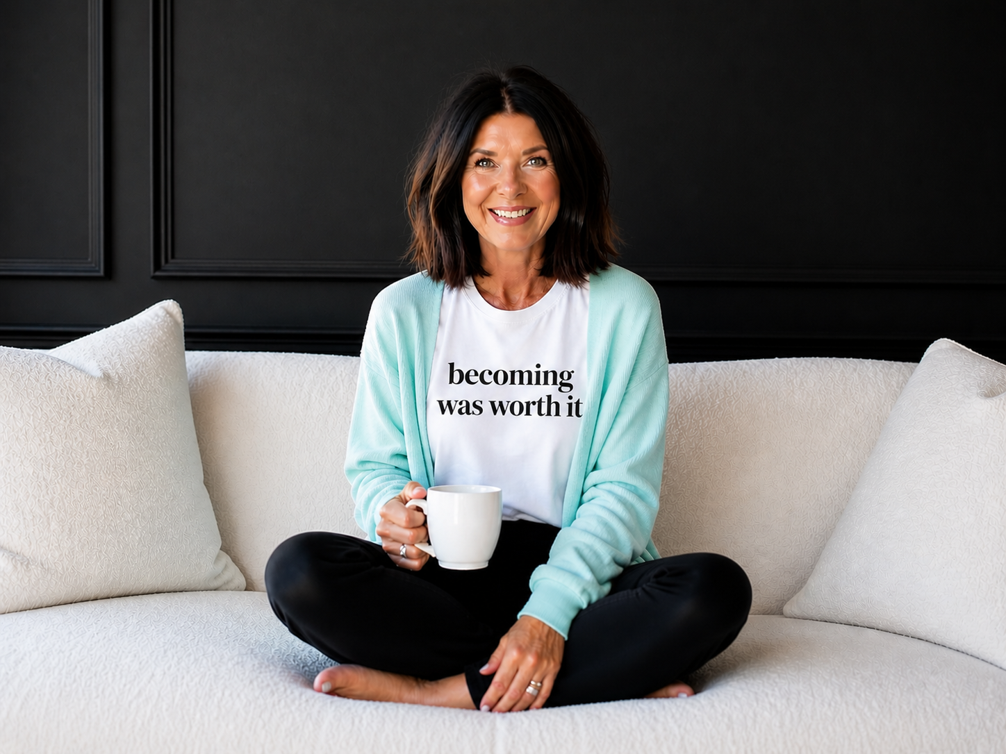 Lori with coffee on couch